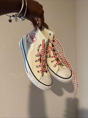 Converse White High-Top Sneakers with Red Heart Laces